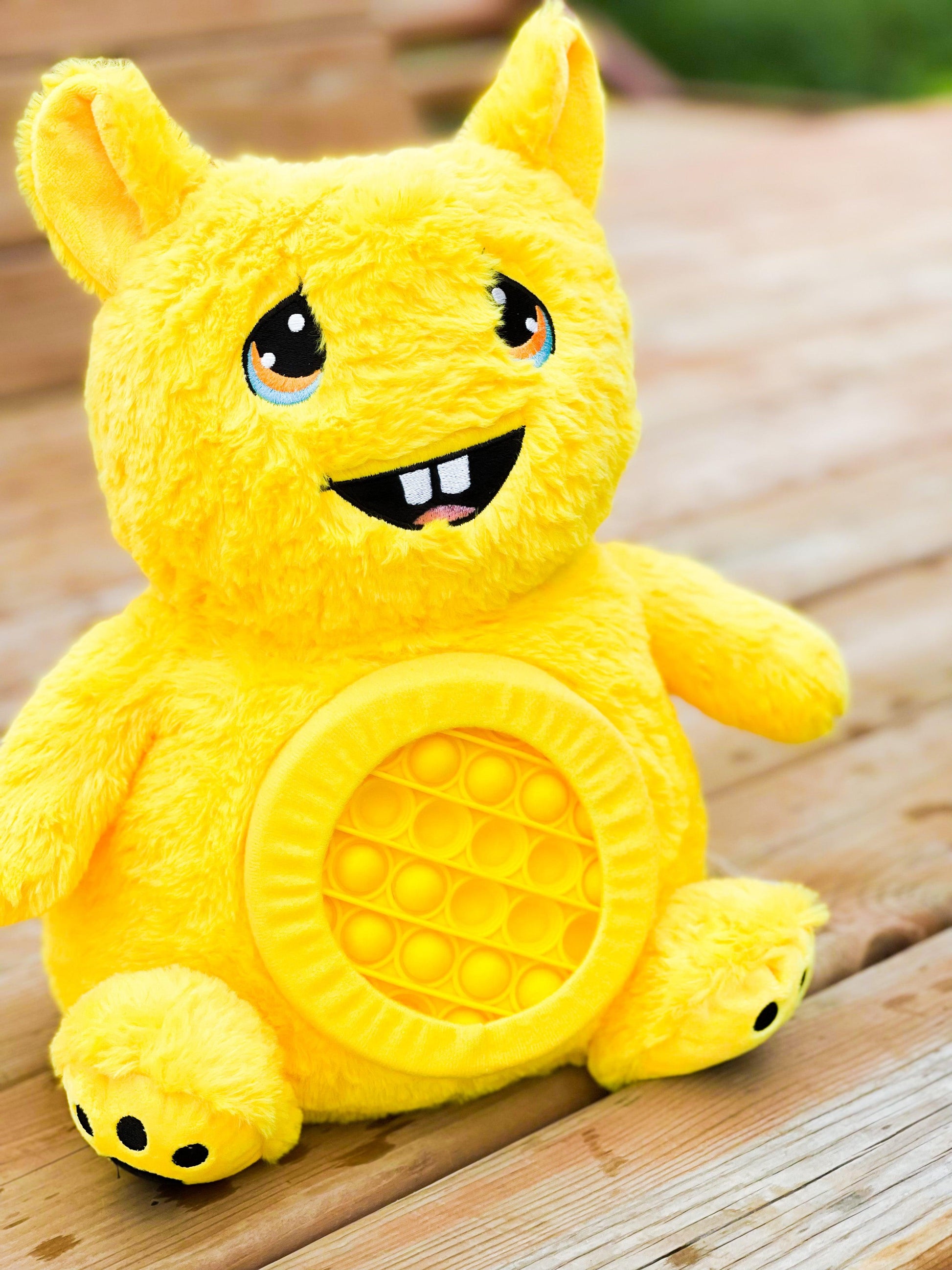 Evy Pop la peluche lourde sensorielle avec Pop it